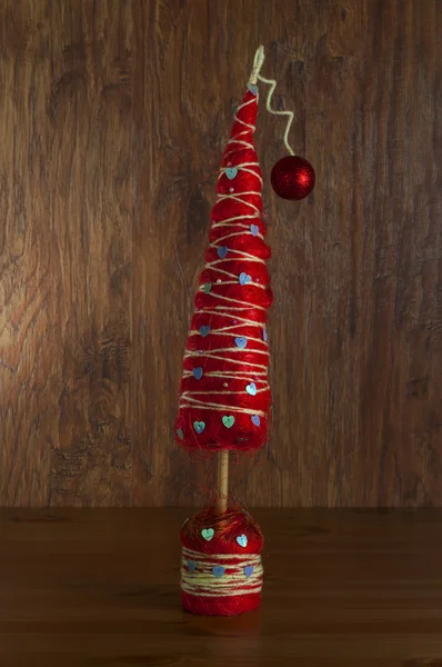 Fir-tree the toy decorated by a rope — Stock Photo, Image