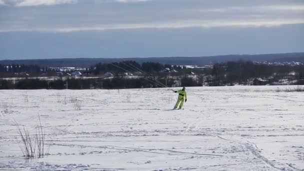 Winter snowkiting on the field. — Stock Video