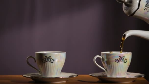 Tea being poured into cup — Stock Video