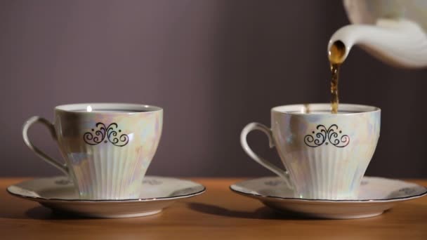 Tea being poured into cup — Stock Video