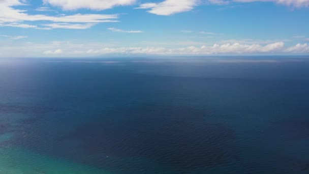 Seascape, aerial view. Blue sea and sky with clouds.