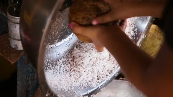 Woman extraction of coconut pulp — Stock Video