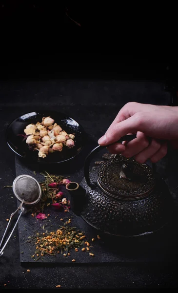 Variety of dry tea with teapot — Stock Photo, Image