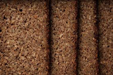 Traditional german, dutch, austrian rye bread Pumpernickel with seeds. Top View. Flat Lay clipart
