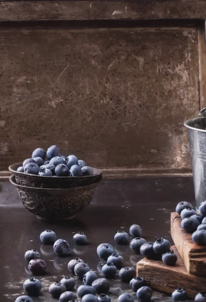 Blueberries on black metal background — Stock Photo, Image