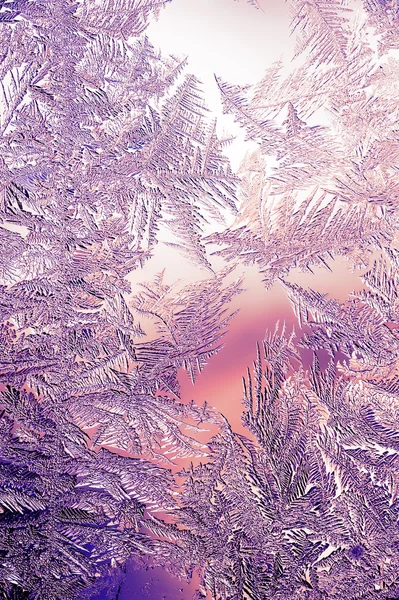 Vackra närbild vinter färgstarka bakgrund med isiga Frost mönster — Stockfoto