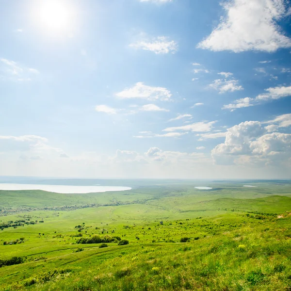 Photo of beautiful landscape with grassy land under sunny skies