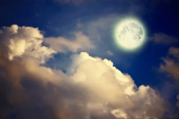 Magic moon over the clouds — Stockfoto