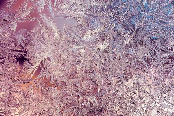 Vackra närbild vinter färgstarka bakgrund med isiga Frost mönster — Stockfoto