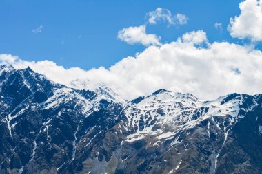 Snow-capped mountain peaks on a clear day, Georgia