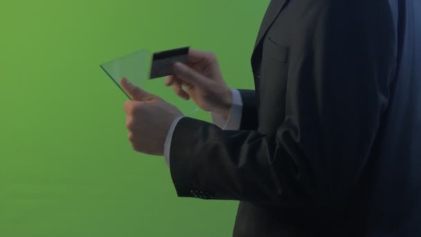 Businessman Comes Types a Number of Card Holding Virtual Tablet Working on Forex Exchange Buys Through Internet Chatting Young Man in a Business Clothes — Stock Video