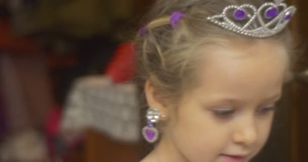 Cute Little Girl is Dancing Turning Winking Girl in Crown Earrings is Dancing at the New-Year Celebration at Home Little Princess Dancing Around a Room — Stock Video