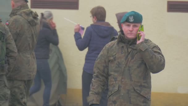 Soldier Takling by Phone Opole Poland Atlantic Resolve Operation Group of Soldiers in a Uniform Military Are Walking Standing Equipment on a City Square — Stock Video