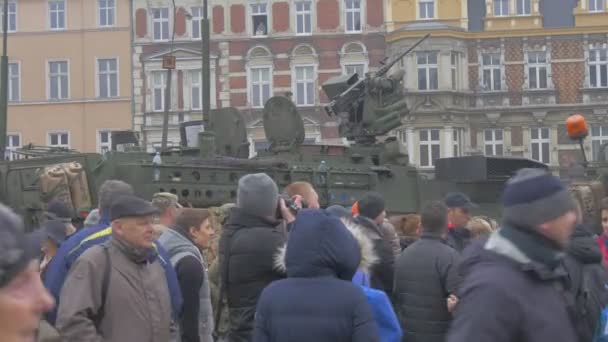 People Taking Photos of Vehicles Opole Poland Atlantic Resolve Operation People Citizens Are Watching the Parade on a City Square Old Buildings Cloudy Day — Stock Video