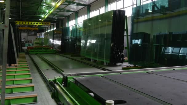 Movement of Robot, Conveyor, Distantly, Large Sheet of Glass, Process of Sheet Glass Cutting, Glass Production — Stock Video