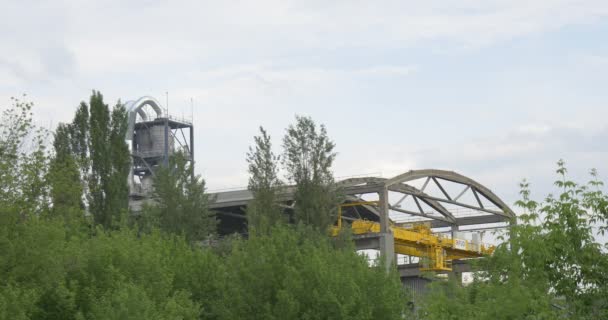 Melal Constructions of Grain Elevator Through The Trees — Stock Video