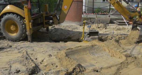 Digging And Earthing The Trench by Excavator on the Sity Street — Stock Footage Digging And Earthing The Trench by Excavator on the Sity Street Stock Video