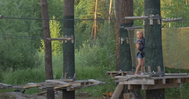 A Little girl gets ready to slide — Stock Video