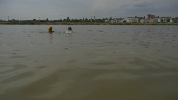 People Swim in a Lake — Stock Video