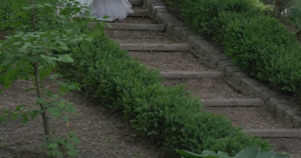 Bride Woman in White Sheath Dress With Long Red Belt No Face in a Frame Girl is Walking Downstairs Slowly Posing in Front of Camera Brides Parade — Stock Video