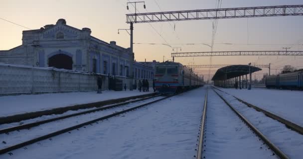 Electric Train Arrives To Konotop Christmas Railway Station Passengers Leave And Enter The Wagons Families Kids Man is Standing Separately Talking by Phone — Stock Video