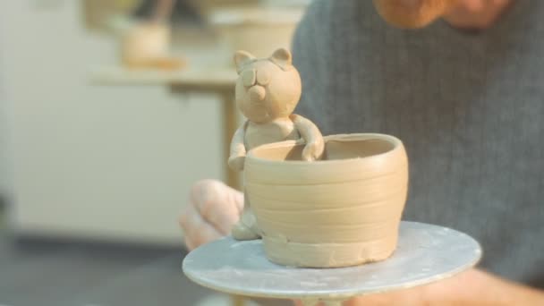 Middle Aged Man Is Sculpting a Tail Cat Statuette Rolling the Detail Working Attentively Concentrated Face Man is Looking in front of Him Pot with Cat — Stok Video