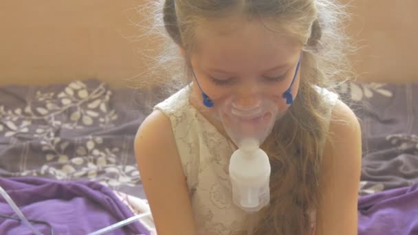 Kid is Sitting on a Bed Straightening An Inhaler Mask Girl is Sitting With Nebulizer Mask Fixed on Her Face Steam is Raising Up Sick Kid in a Ward — Stock Video