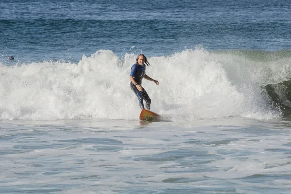 Mature surfer rides shore break California — Stock Photo, Image