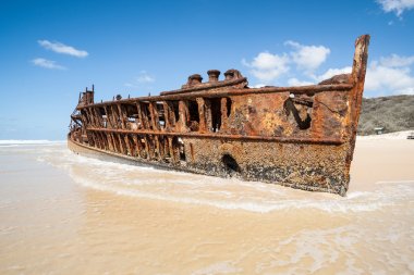 Old rustiing Maheno shipwreck on Fraser Island, Queensland Australia clipart