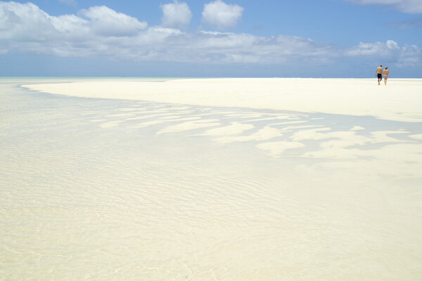 White tropical sand stretching to horizon