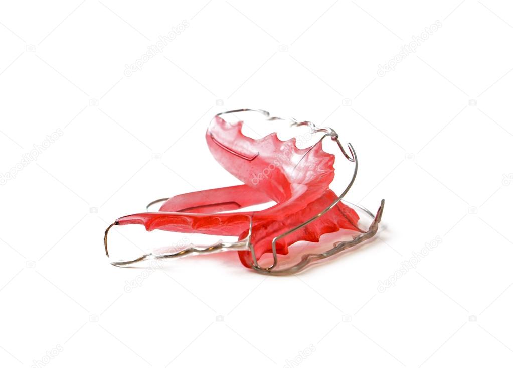 Red dental retainer orthodontia, isolated on white background