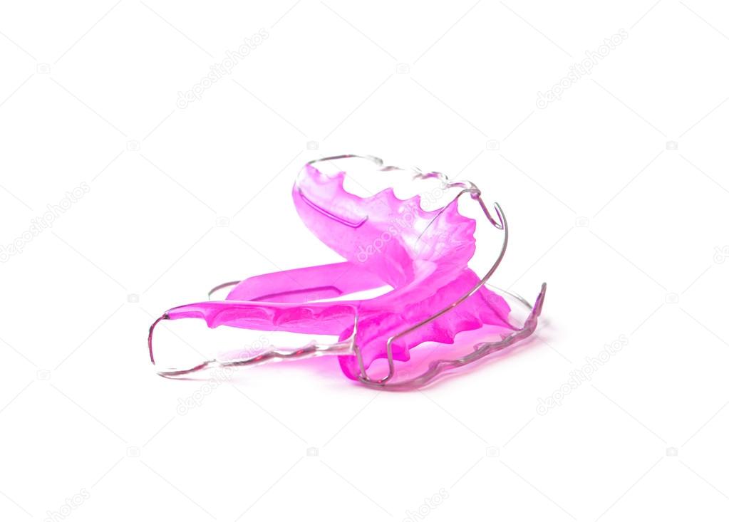 Pink dental retainer orthodontia, isolated on white background