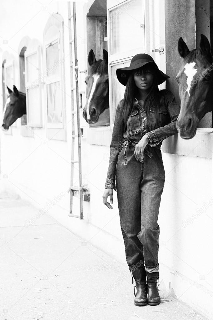 Beautiful black woman posing in stable