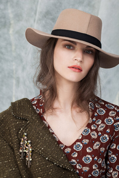 young girl in  hat posing