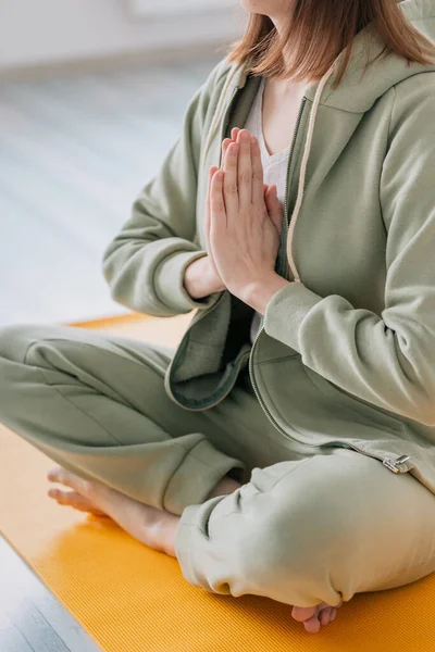 meditation and yoga at home, beautiful and young European woman doing yoga