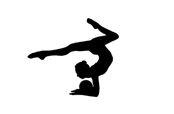 Flexibla unga gymnasten utför ett element i studion — Stockfoto