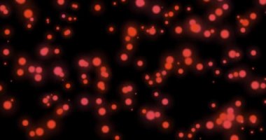 Bulanık daireler çiziyorum. Hareket animasyonu siyah zemin üzerindeki kırmızı, turuncu ve sarı daireleri bulanıklaştırdı. Odaklanamama etkisi. Lav lambası. Yatay bileşim, 4k video kalitesi