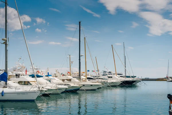 The Italian coast. Seaport. Motor boat and yacht moored in the port — Stock Photo, Image