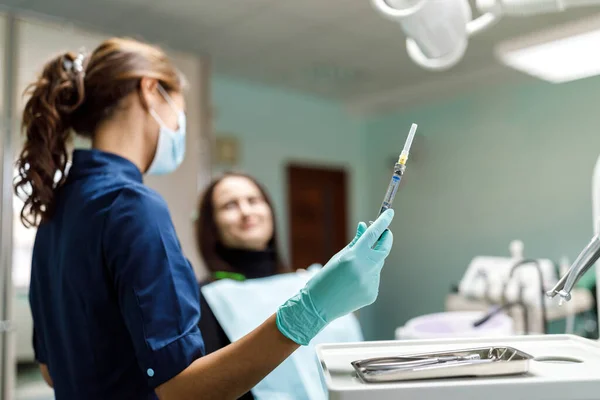 Young Woman Sits Dentist Chair Dentist Carefully Examines Patient Teeth — Stock Photo, Image