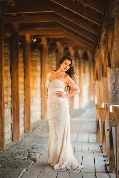 Wedding day. Gorgeous bride walking next to castle in west Ukrai — Stock Photo, Image