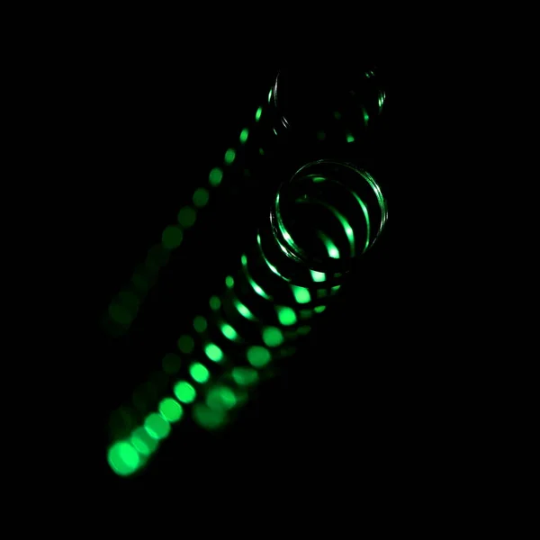 Close-up ballpoint pen against a black background