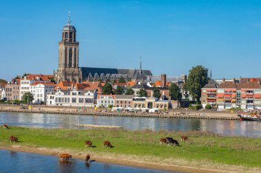 Cityscape of Deventer with St Lebunus Church and Ijssel river clipart
