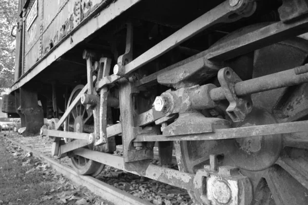 Black and White - Old Steam Engine Train at Crdoba Park. Andaluca, Spain. Rusty steam engine left as monument or decoration in Crdoba Park. Gloomy day, abandoned train. Mechanics, engine, cabin.