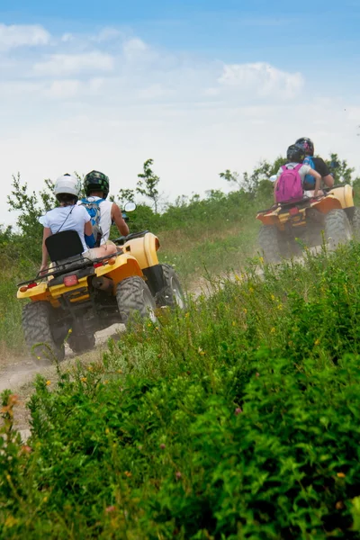 Quad bike on a country road — Stock Photo, Image