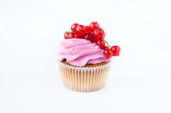 Cupcakes with pink cream and red currant — Stock Photo, Image