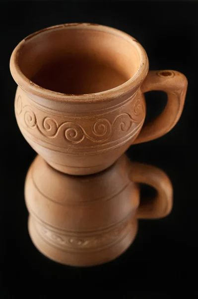 Beautiful old cup made ??of clay with patterns — Stock Photo, Image