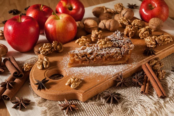 cake with apples, nuts and cinnamon