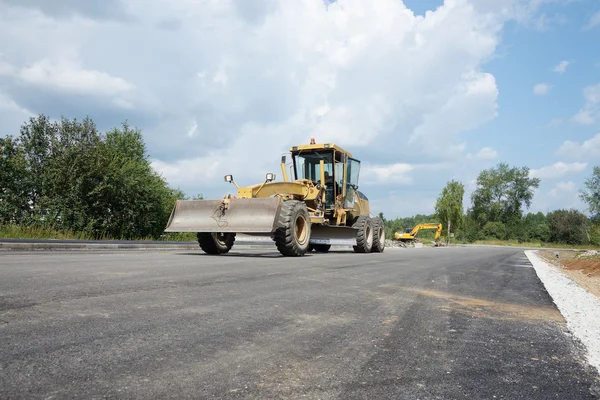 Opravy silnice a buldozer — Stock fotografie