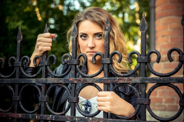 Fashion girl posing with leather jacket — Stock Photo, Image