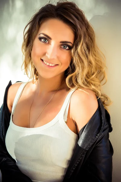 Fashion girl posing with leather jacket — Stock Photo, Image